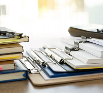 desk with papers and office supplies